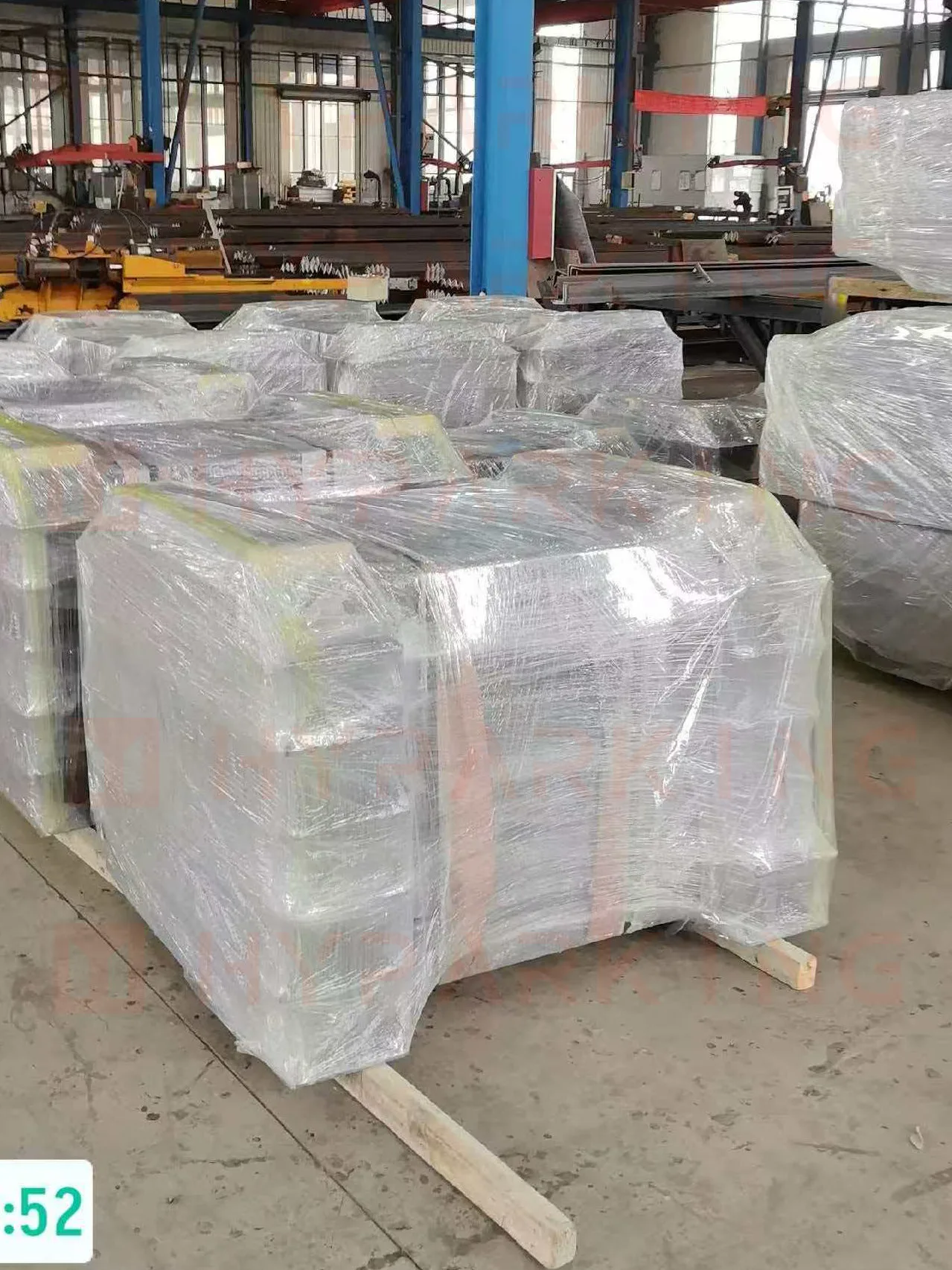 Parking system units strapped on wooden skids with edge protection, staged for the Miami shipment