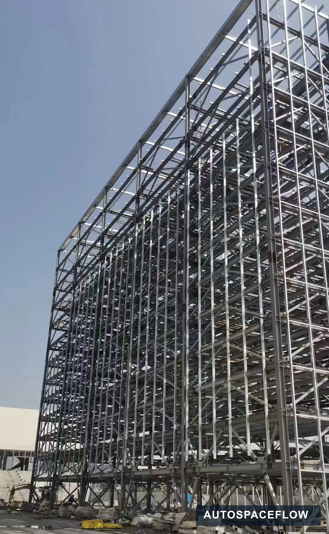 Corner view of the multi-level steel frame for the Romania tower parking project